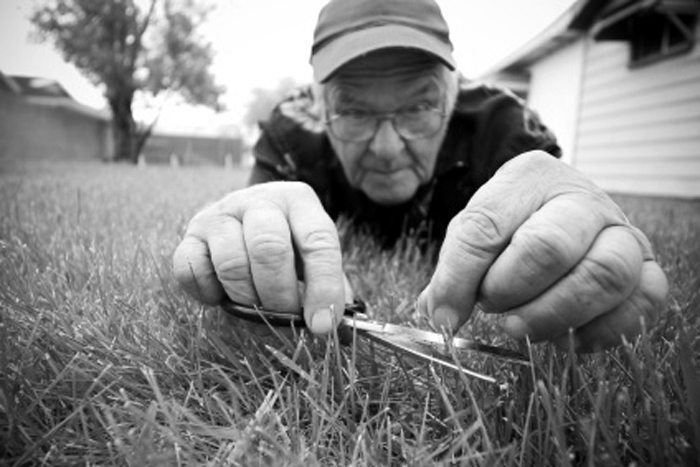 cutting-grass-with-scissors